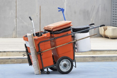 Skip hire truck outside a Camden Town property with staff preparing a skip