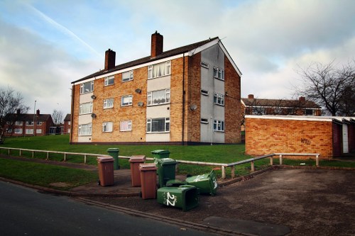Man and van preparing to collect waste from a flat